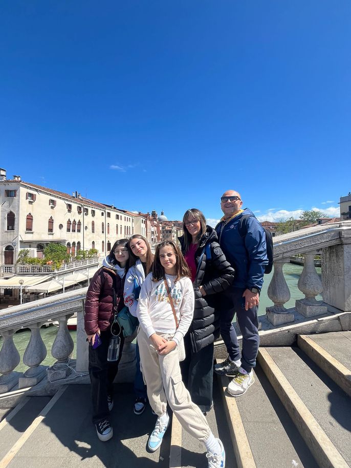 High school student with host family in Italy on steps
