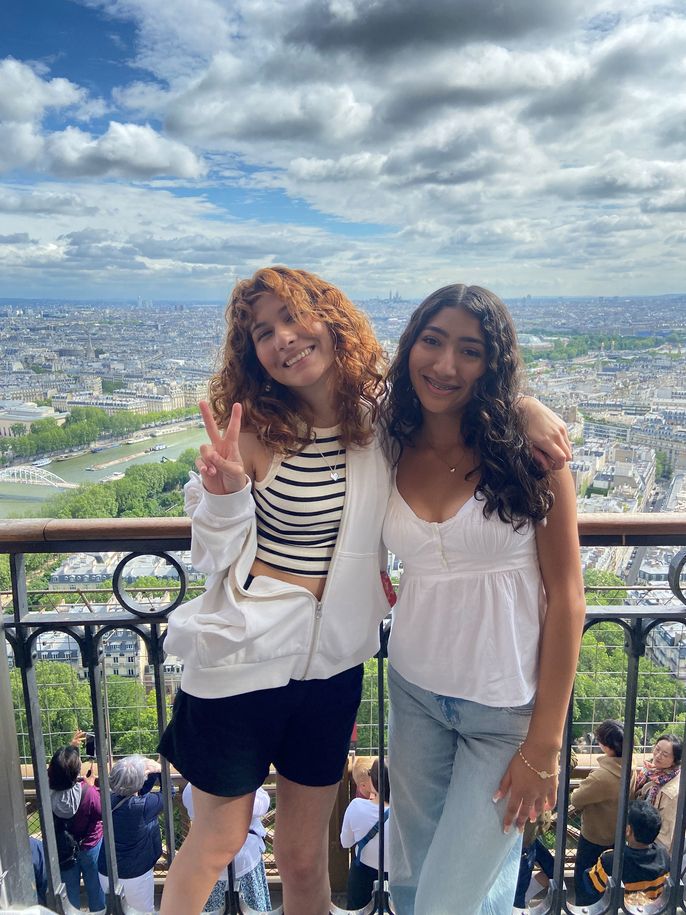 Students taking a selfie on the Eiffel Tower in Paris