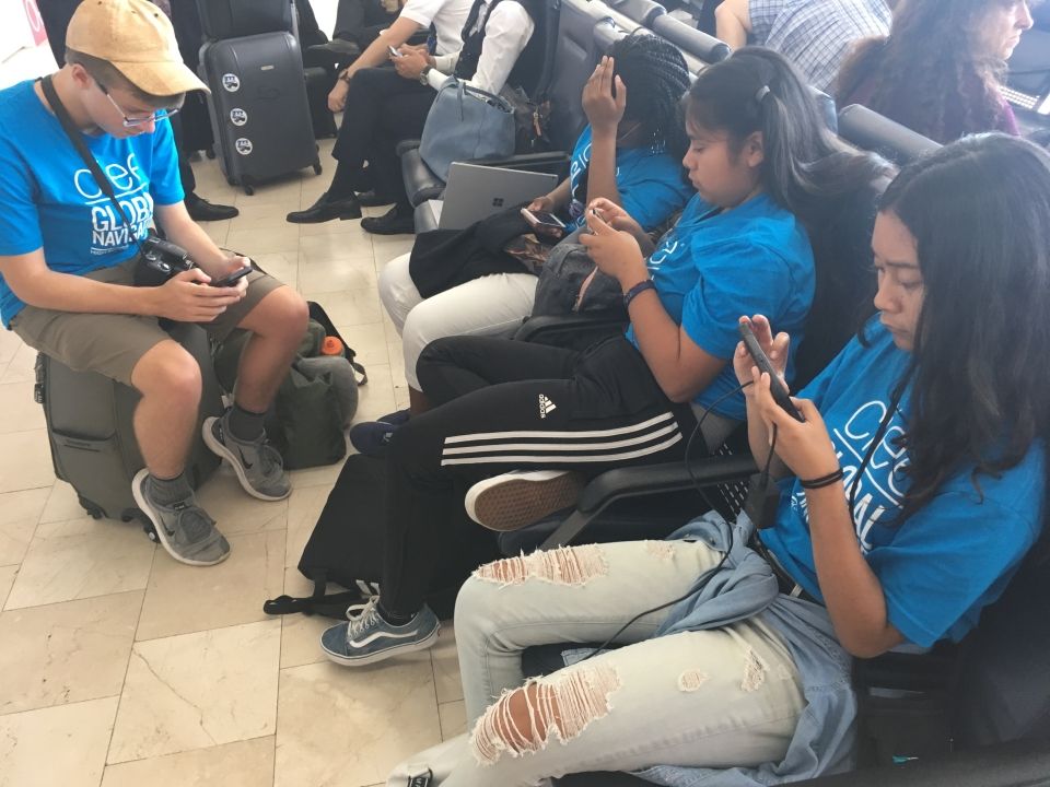 Ana, Leilani, Tova, and Connor take a break from chatting to play games on their phones. For the next three weeks, phones will be away as they discover a culture completely new to them.