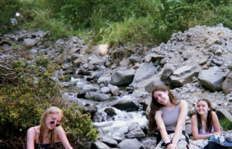 Meika, Eva, and Kait harvesting plants from the river to populate the frog ponds.