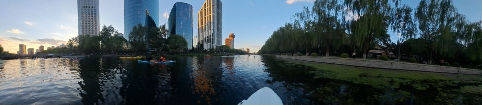 Stand up paddle boarding on Liangma River in central Beijing near the US Embassy.