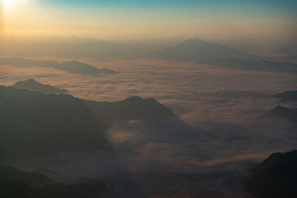 Phu Chi Fa mountain with mist around it. 