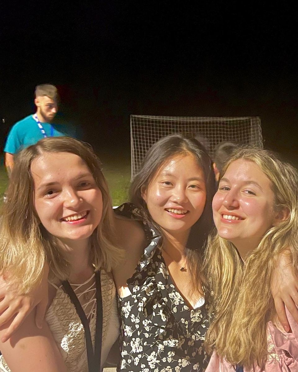 Eleni with two friends on soccer field