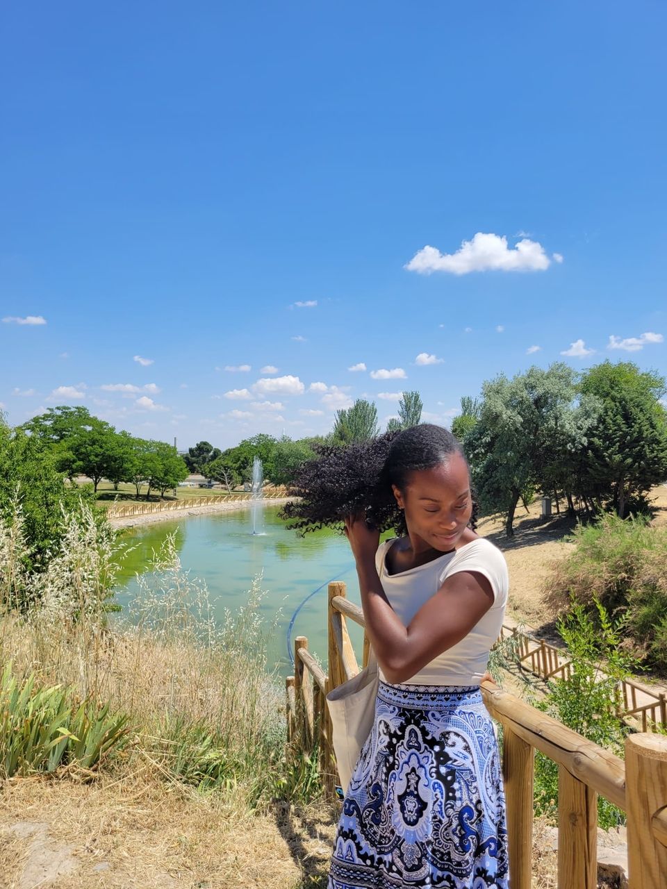 girl in the park in getafe. She is black and is living abroad