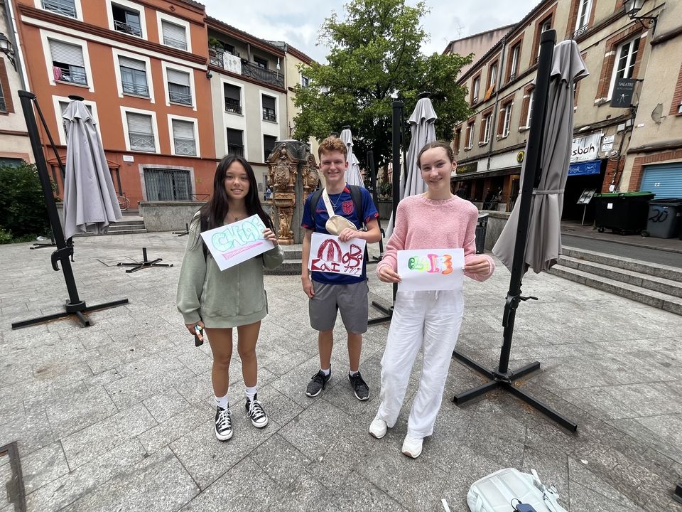 Students pose with their creations