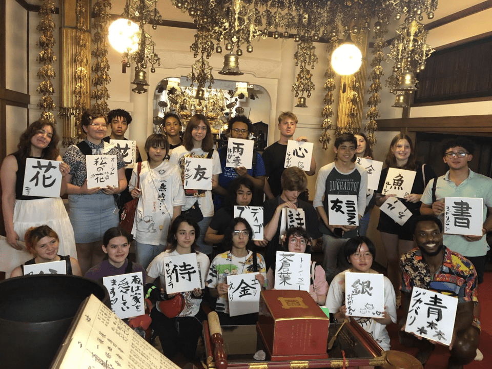 Students showing off there calligraphy works