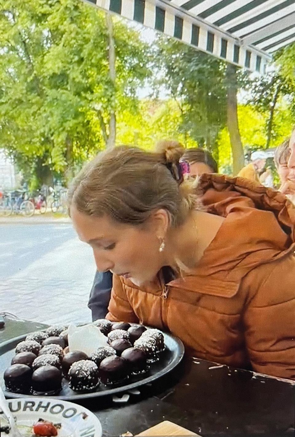 Student blowing out birthday candles