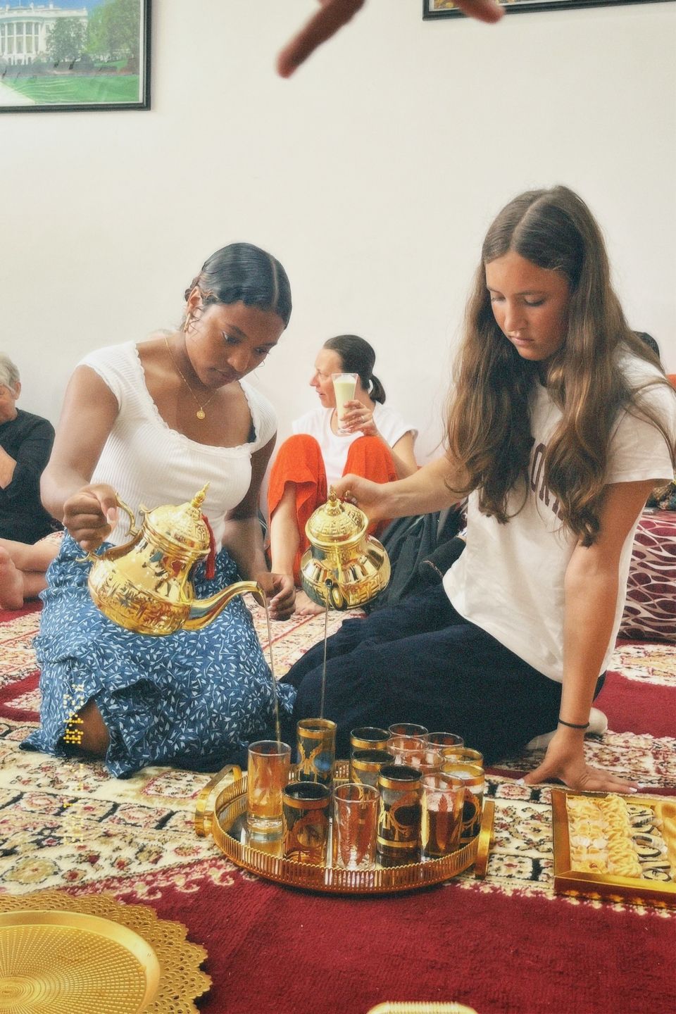 Tea Pouring Professionals: Grace and Isabel