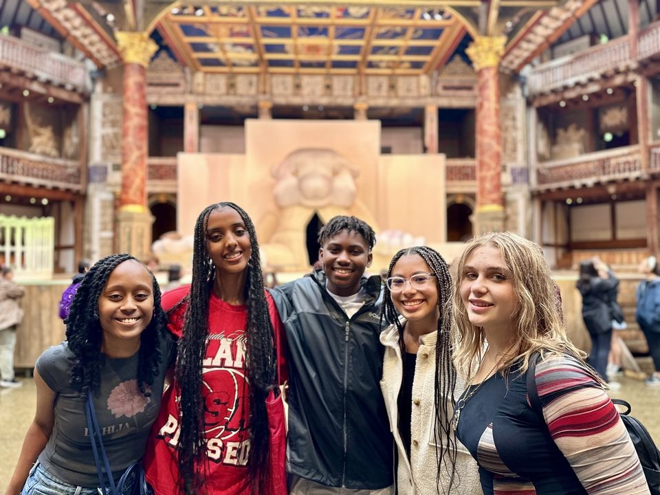 Zora, Sesina, Kris, Katelyn, and Julia pose in front of the stage at Shakespeare's Globe