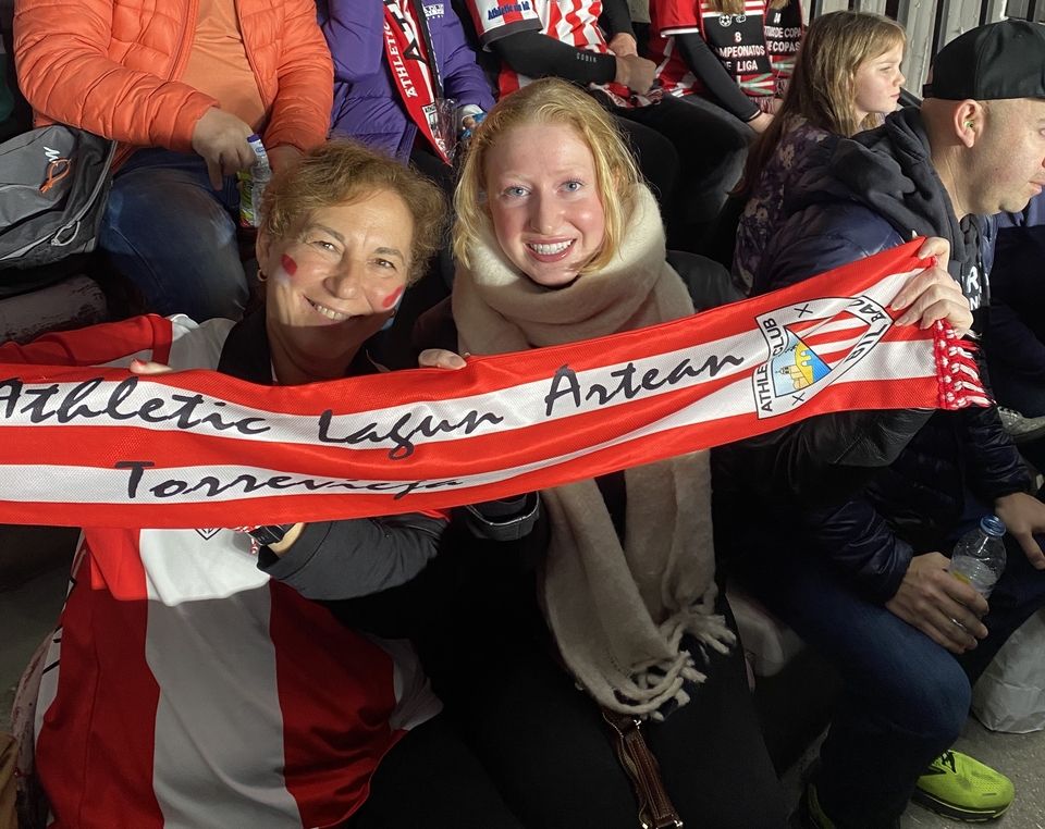 Anna and friend with an Athletic Club scarf