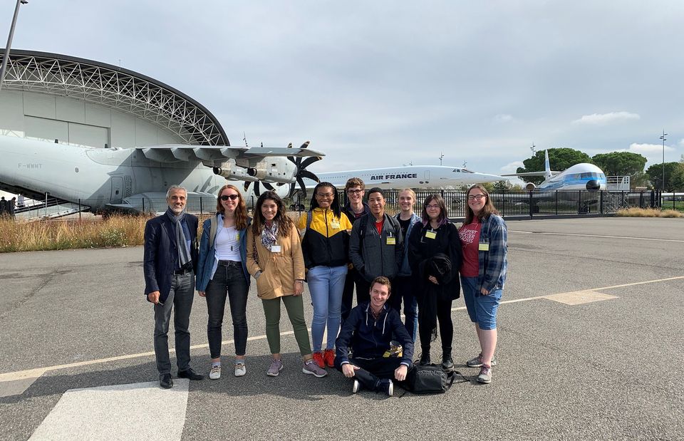 students abroad airport museum professor